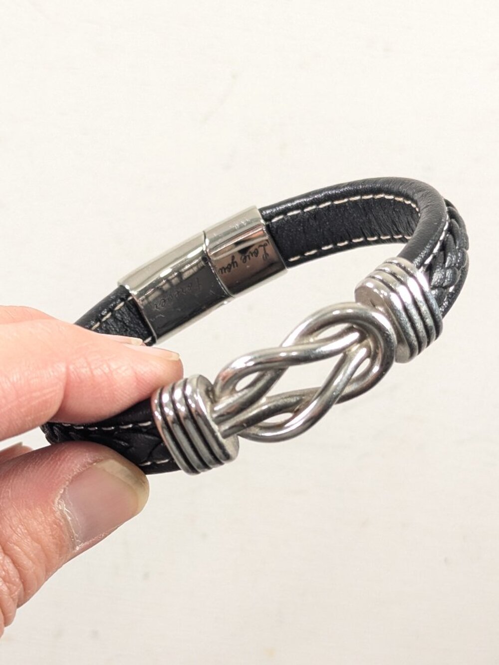Silver toned Infinity knot / Slip knot black leather bangle bracelet